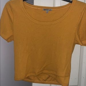 Orange cropped top with design at the bottom